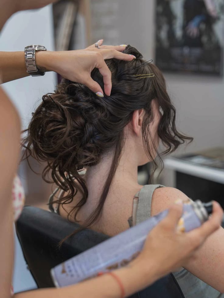 Woman receiving professional hair styling service in Delhi salon