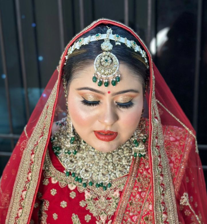 Beautiful bride with traditional HD bridal makeup by makeup artist in Delhi